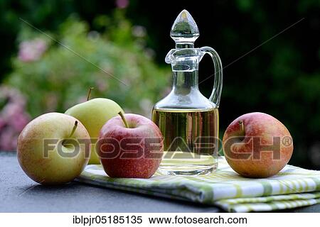 Carafe with apple vinegar and apples View Large Photo Image Stock Photography - Carafe with apple vinegar and apples. Fotosearch