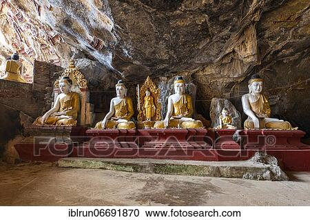 Stock Image - Cave filled with buddhas, Kawgun cave, Hpa-An, Kayin state, Myanmar, Asia. Fotosearch