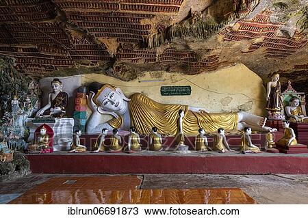 Stock Image - Cave filled with buddhas, Kawgun cave, Hpa-An, Kayin state, Myanmar, Asia. Fotosearch