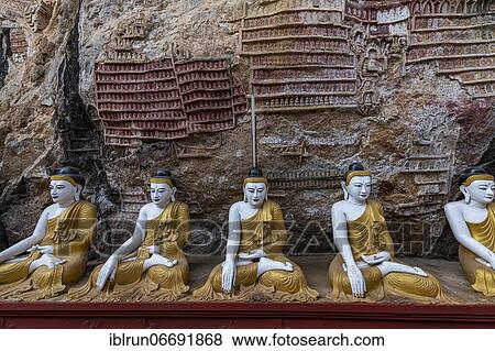 Stock Photo - Cave filled with buddhas, Kawgun cave, Hpa-An, Kayin state, Myanmar, Asia. Fotosearch