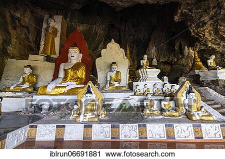 Stock Image - Cave filled with buddhas, Yathaypyan cave, Hpa-An, Kayin state, Myanmar, Asia. Fotosearch