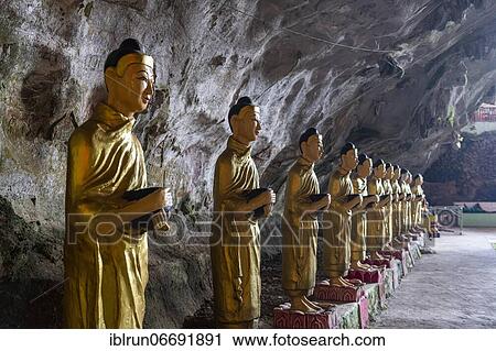 Stock Image - Caved filled with buddhas, Saddan cave, Hpa-An, Kayin state, Myanmar, Asia. Fotosearch