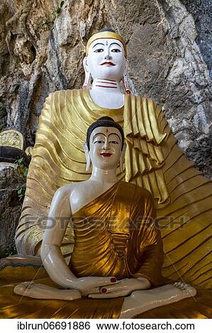Stock Photograph - Caved filled with buddhas, Saddan cave, Hpa-An, Kayin state, Myanmar, Asia. Fotosearch
