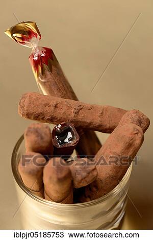 Cherry stalks, cherry stalks, cherry stem, Swiss speciality, chocolate stalks with cherry brandy filling View Large Photo Image Stock Image - Cherry stalks, cherry stalks, cherry stem, Swiss speciality, chocolate stalks with cherry brandy filling. Fotosearch