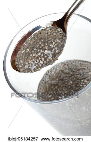 Stock Photo - Chia (Salvia hispanica), swollen, in glass with water. Fotosearch