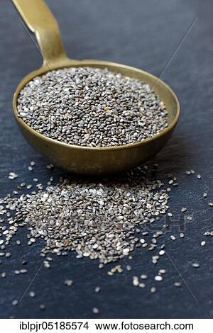 Picture - Chia seeds ( Salvia hispanica) in ladle. Fotosearch