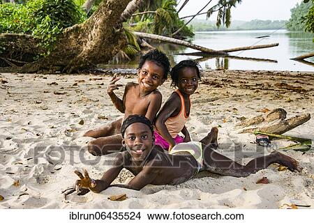 Children playing in the sand, east of Buchanan, Liberia, Africa View Large Photo Image Picture - Children playing in the sand, east of Buchanan, Liberia, Africa. Fotosearch