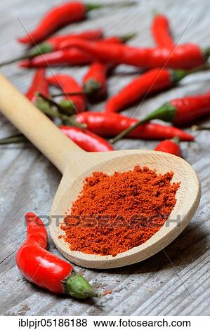 Chili, chili powder in wooden spoons and chili peppers ( Capsicum annuum) View Large Photo Image Stock Photo - Chili, chili powder in wooden spoons and chili peppers ( Capsicum annuum). Fotosearch