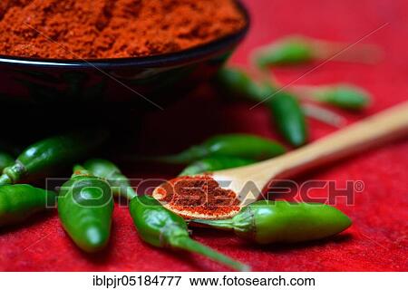 Chili powder in bowl and spoon and green chillies( Capsicum annuum), paprika powder, chillies, kitchen spice, peppers View Large Photo Image Stock Photo - Chili powder in bowl and spoon and green chillies( Capsicum annuum), paprika powder, chillies, kitchen spice, peppers. Fotosearch