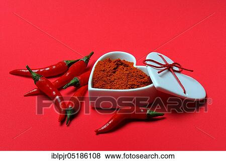 Stock Photo - Chili powder in bowl with heart shape, chili peppers( Capsicum annuum), I love chili. Fotosearch
