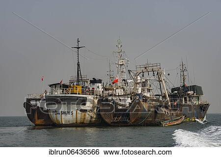 Chinese fishing boats in Freetown, Sierra Leone, Africa View Large Photo Image Stock Photograph - Chinese fishing boats in Freetown, Sierra Leone, Africa. Fotosearch