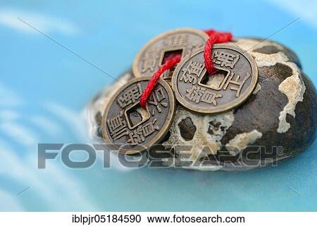 Chinese lucky coins, on stone View Large Photo Image Stock Image - Chinese lucky coins, on stone. Fotosearch