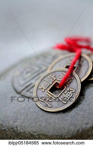 Chinese lucky coins on stone with seal, Feng Shui View Large Photo Image Stock Photography - Chinese lucky coins on stone with seal, Feng Shui. Fotosearch