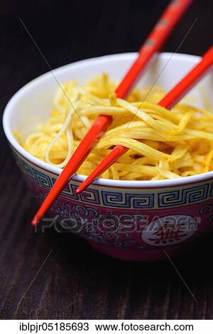 Chinese noodles in bowl with chopsticks, cooked, nest noodles, curry sauce View Large Photo Image Stock Image - Chinese noodles in bowl with chopsticks, cooked, nest noodles, curry sauce. Fotosearch