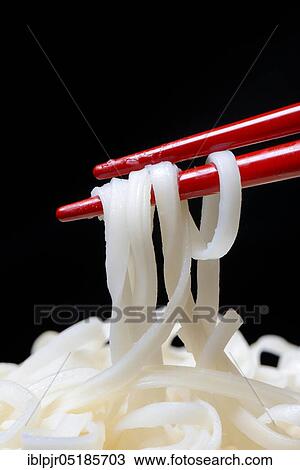 Chinese noodles with chopsticks, cooked View Large Photo Image Stock Image - Chinese noodles with chopsticks, cooked. Fotosearch