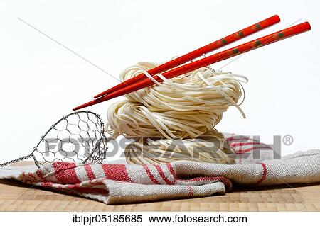 Chinese Yangchun noodles with chopsticks, uncooked, nest noodles View Large Photo Image Stock Photography - Chinese Yangchun noodles with chopsticks, uncooked, nest noodles. Fotosearch