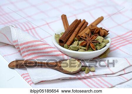 Picture - Christmas spices in bowl and powder in spoon, sticks, star anise, Ginger. Fotosearch