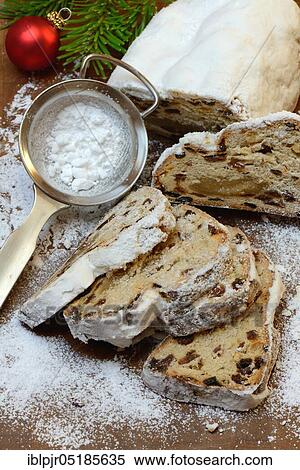 Christmas stollen and sieve with icing sugar View Large Photo Image Stock Photography - Christmas stollen and sieve with icing sugar. Fotosearch
