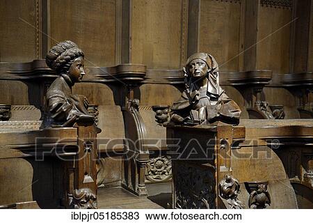 Stock Image - Church pews in the choir of the Ulm Cathedral, Choir Stalls, Tiburtinian Sybille and Hellespontic Sybille, Ulm, Baden-Württemberg, Germany, Europe. Fotosearch