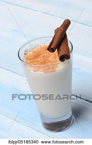 Cinnamon milk in glass and cinnamon sticks View Large Photo Image Stock Image - Cinnamon milk in glass and cinnamon sticks. Fotosearch