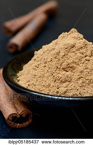 Cinnamonpowder and rods View Large Photo Image Stock Photo - Cinnamonpowder and rods. Fotosearch