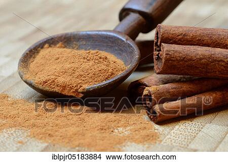 Cinnamonpowder (Cinnamomum spec. ) in wooden spoons and sticks View Large Photo Image Picture - Cinnamonpowder (Cinnamomum spec. ) in wooden spoons and sticks. Fotosearch