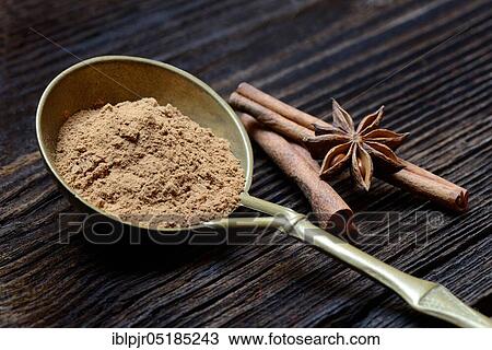 Cinnamonpowder ( Cinnamomum spec. ) in brass ladle and star anise sticks View Large Photo Image Stock Image - Cinnamonpowder ( Cinnamomum spec. ) in brass ladle and star anise sticks. Fotosearch