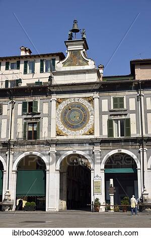 Stock Image - Clock tower with historical astronomical clock, Piazza della Loggia, Province of Brescia, Lombardy, Italy, Europe. Fotosearch