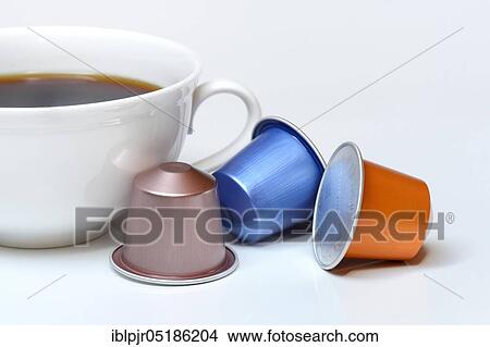 Coffee capsules and coffee cup with coffee View Large Photo Image Picture - Coffee capsules and coffee cup with coffee. Fotosearch