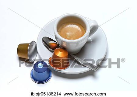Coffee capsules and coffee cup with espresso View Large Photo Image Picture - Coffee capsules and coffee cup with espresso. Fotosearch