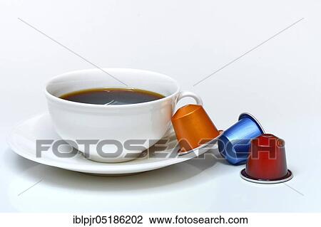 Coffee capsules and coffee cup with coffee View Large Photo Image Stock Image - Coffee capsules and coffee cup with coffee. Fotosearch