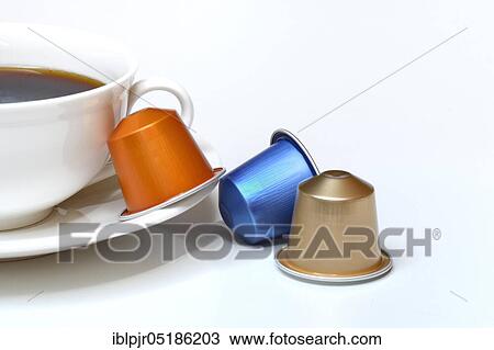 Coffee capsules and coffee cup with coffee View Large Photo Image Stock Image - Coffee capsules and coffee cup with coffee. Fotosearch