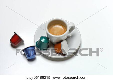 Stock Photography - Coffee capsules and coffee cup with espresso. Fotosearch