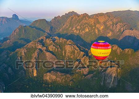 Colorful hot air balloon in the air, karst mountains Vang Vieng, Vientiane Province, Laos, Asia View Large Photo Image Stock Image - Colorful hot air balloon in the air, karst mountains Vang Vieng, Vientiane Province, Laos, Asia. Fotosearch