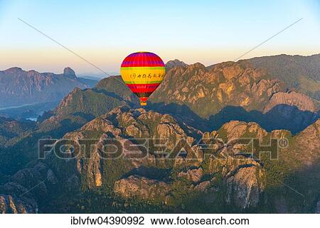 Colorful hot air balloon in the air, karst mountains Vang Vieng, Vientiane Province, Laos, Asia View Large Photo Image Stock Image - Colorful hot air balloon in the air, karst mountains Vang Vieng, Vientiane Province, Laos, Asia. Fotosearch