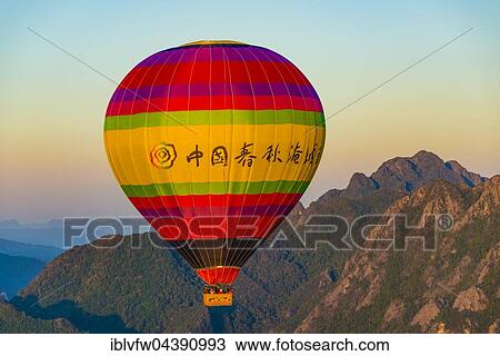 Colorful hot air balloon in the air, Karst Mountains behind, Vang Vieng, Vientiane Province, Laos, Asia View Large Photo Image Stock Image - Colorful hot air balloon in the air, Karst Mountains behind, Vang Vieng, Vientiane Province, Laos, Asia. Fotosearch