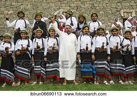Stock Image - Colourful dressed traditional men, Al Janadriyah Festival, Riadh, Saudi Arabia, Asia. Fotosearch
