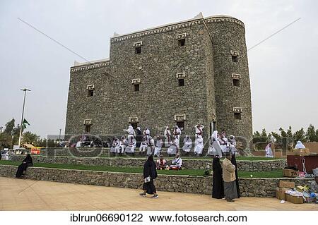 Stock Image - Colourful dressed traditional men, Al Janadriyah Festival, Riadh, Saudi Arabia, Asia. Fotosearch