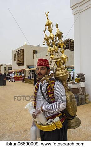Stock Photo - Colourful dressed traditional tea sekker, Al Janadriyah Festival, Riadh, Saudi Arabia, Asia. Fotosearch