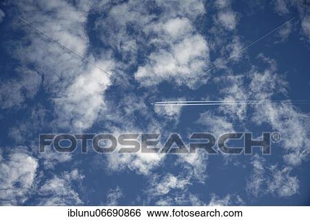 Commercial airplane in blue cloudy sky, Bern, Switzerland, Europe View Large Photo Image Stock Photograph - Commercial airplane in blue cloudy sky, Bern, Switzerland, Europe. Fotosearch