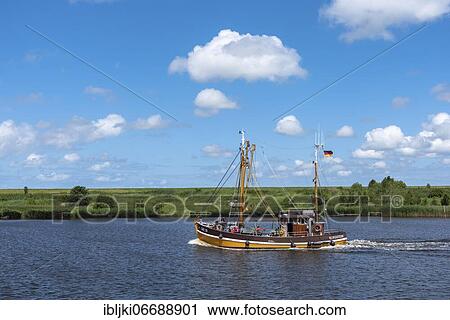 Stock Image - Crab cutter in the Leyhörner-Sieltief, Greetsiel, Lower Saxony, Germany, Europe. Fotosearch