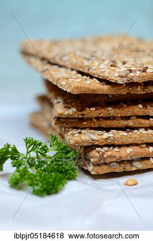 Stock Photo - Crispbread with seeds, flaxseed, sesame seed, sunflower seeds. Fotosearch