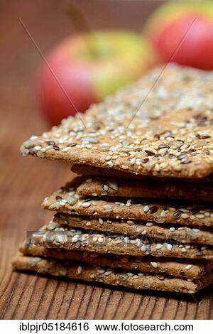 Stock Photograph - Crispbread with seeds, flaxseed, sesame seed, sunflower seeds. Fotosearch