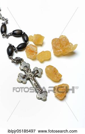 Stock Photo - Crucifix and incense resin. Fotosearch