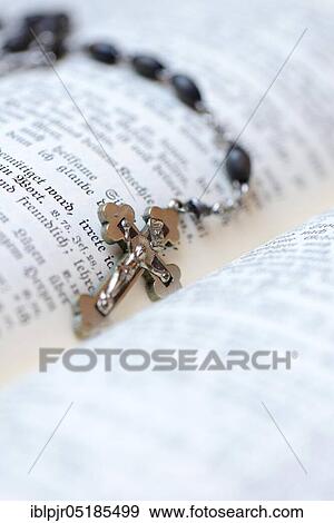 Stock Photo - Crucifix on bible. Fotosearch