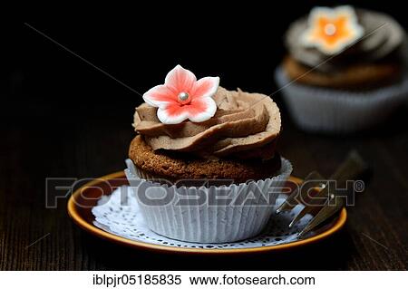 Cupcake on plate with cake fork View Large Photo Image Stock Photography - Cupcake on plate with cake fork. Fotosearch