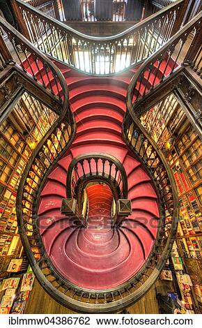 Curved wooden staircase in library, Livraria Lello & Irmão bookstore, Porto, Portugal, Europe View Large Photo Image Stock Image - Curved wooden staircase in library, Livraria Lello & Irmão bookstore, Porto, Portugal, Europe. Fotosearch