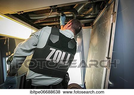 Customs officer searches for contraband and narcotics in ICE train on Rhine Valley route to Switzerland, Freiburg, Baden-Württemberg, Germany, Europe View Large Photo Image Stock Photo - Customs officer searches for contraband and narcotics in ICE train on Rhine Valley route to Switzerland, Freiburg, Baden-Württemberg, Germany, Europe. Fotosearch