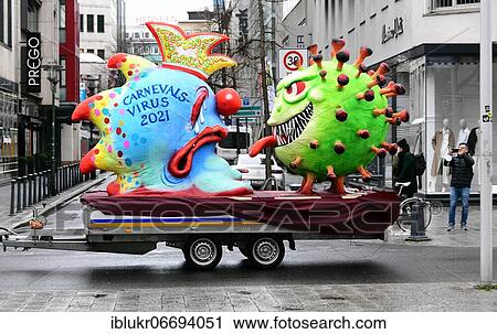 Stock Image - Despite the carnival being cancelled because of Corona, float builder Jacques Tilly sends a few theme floats through the almost empty Düsseldorf on Rose Monday. Fotosearch