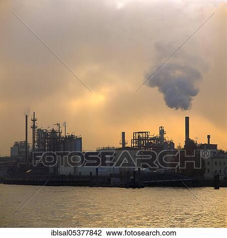 Stock Image - Distillerie in the Port of Hamburg in fog, Germany, Europe. Fotosearch